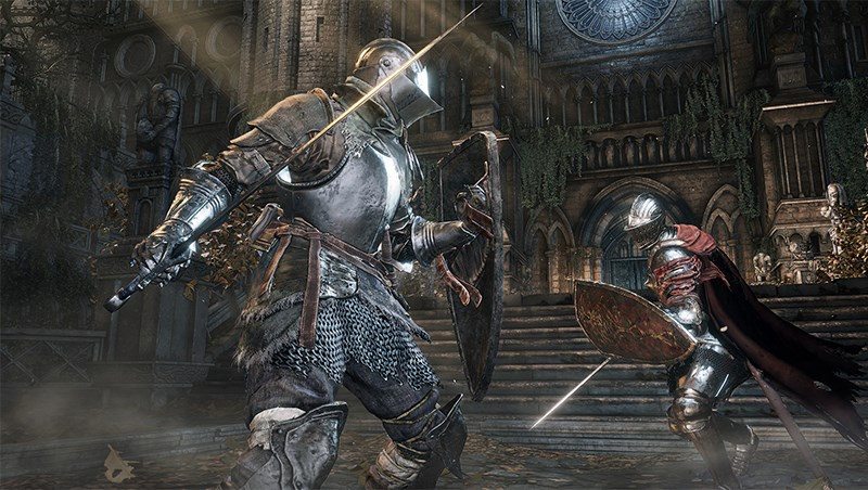 alt text: Chiến binh đối đầu với quái vật khổng lồ trong Dark Souls III