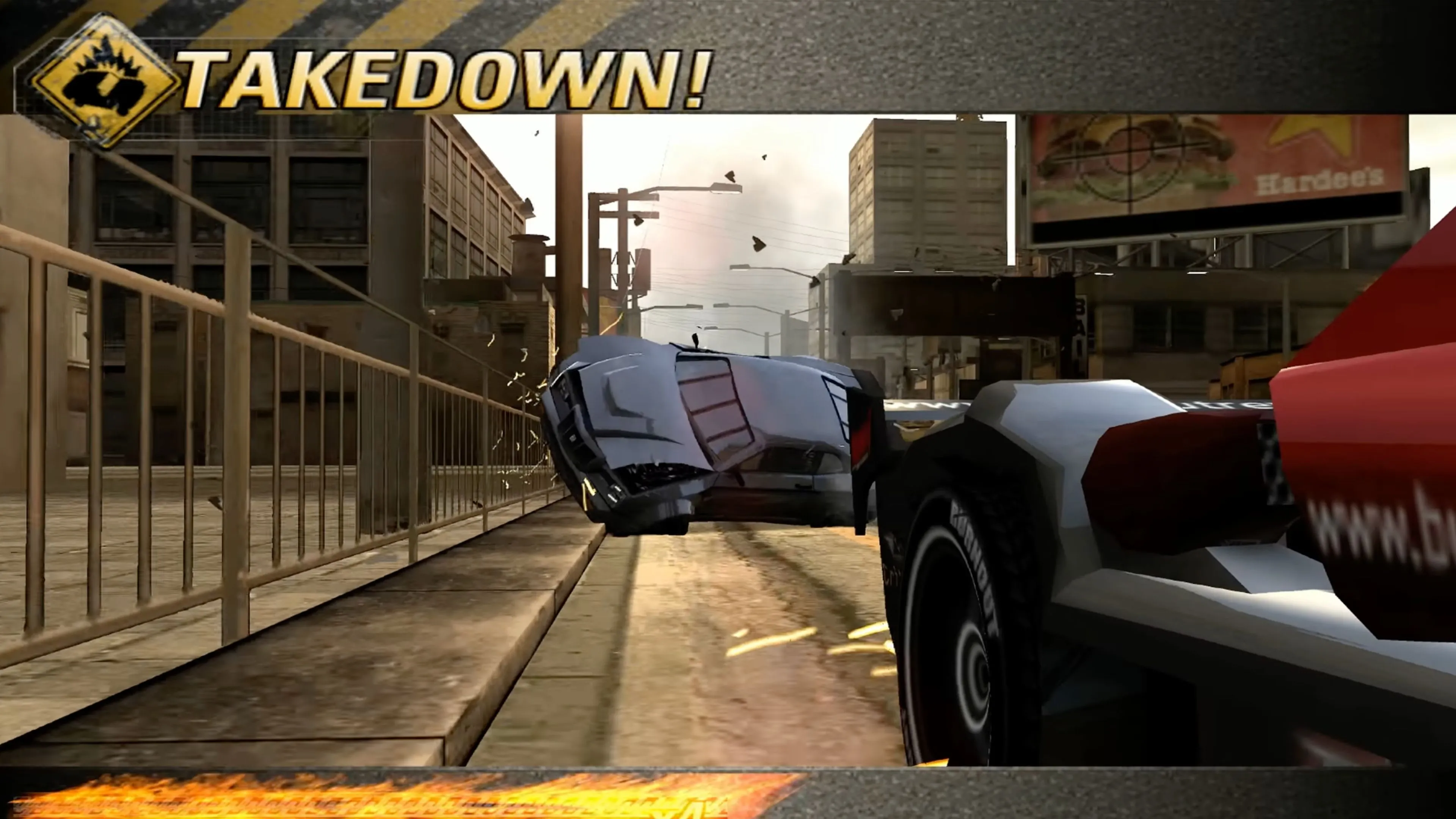Ảnh chụp màn hình trong game Burnout Revenge với cảnh va chạm tóe lửa