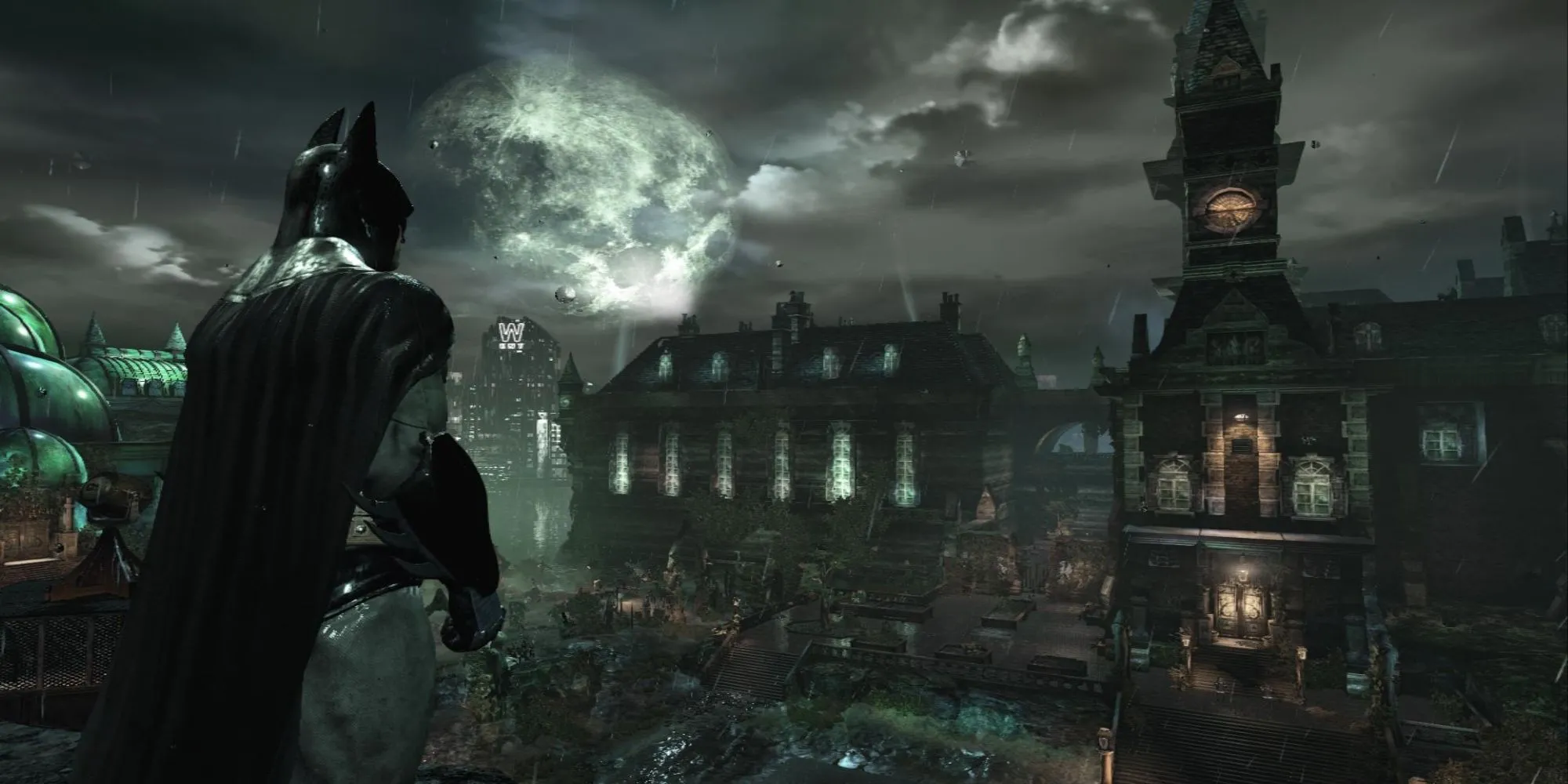 Batman đứng trong một hành lang tối của nhà thương điên Arkham Asylum