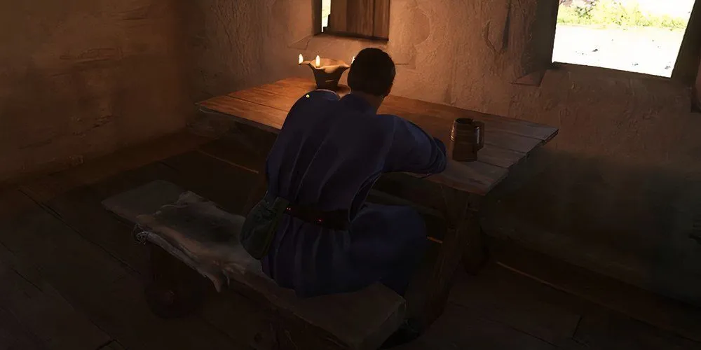 Chernik ngồi trong quán rượu ở Bylany, một nhân vật quan trọng trong việc tìm Mikush ở KCD2