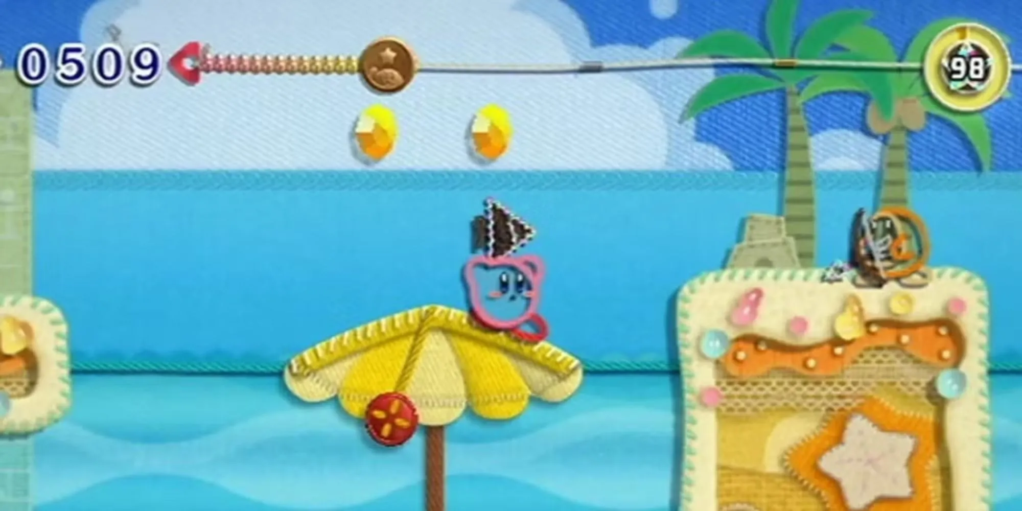 Kirby nhắm mục tiêu vào một cung thủ Waddle Dee trong Kirby's Epic Yarn.