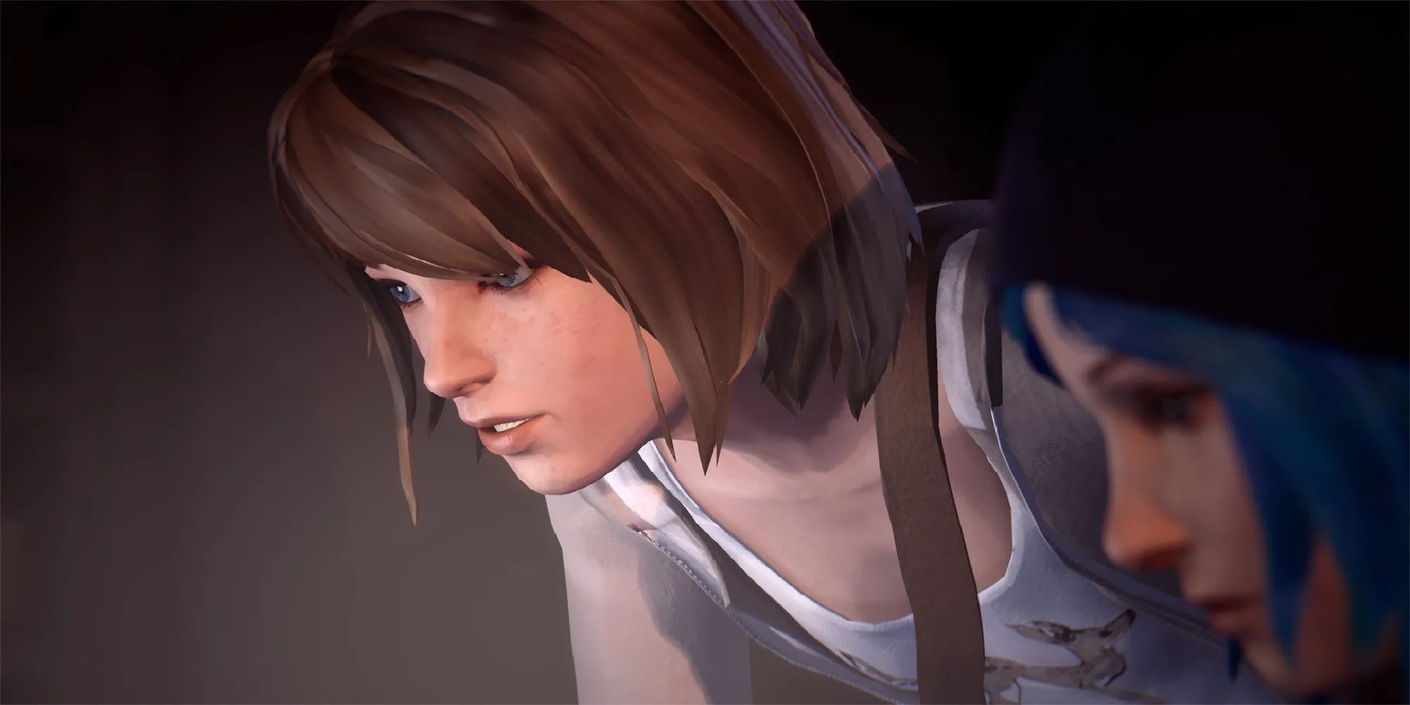 Max Caulfield và Chloe Price cùng nhìn vào máy tính, một khoảnh khắc quan trọng thể hiện mối quan hệ phức tạp và sâu sắc giữa hai nhân vật chính trong Life is Strange.