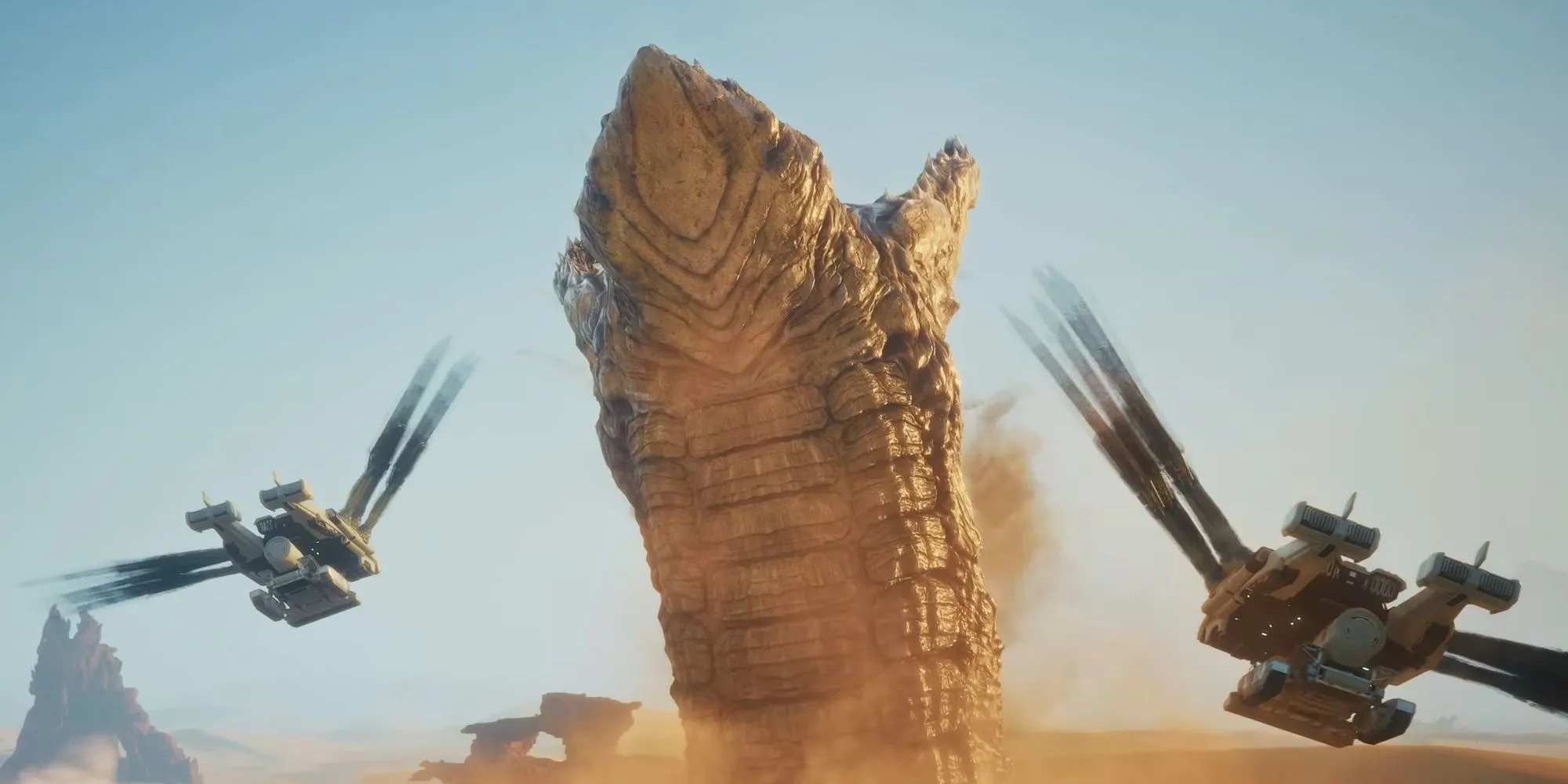 Một con sâu cát khổng lồ và các máy bay ornithopter trong Dune: Awakening