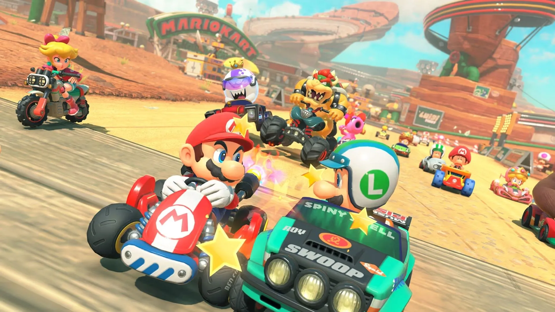 Gameplay Mario Kart World trên đường đua đầy màu sắc, có thể thấy các vật phẩm và chướng ngại vật