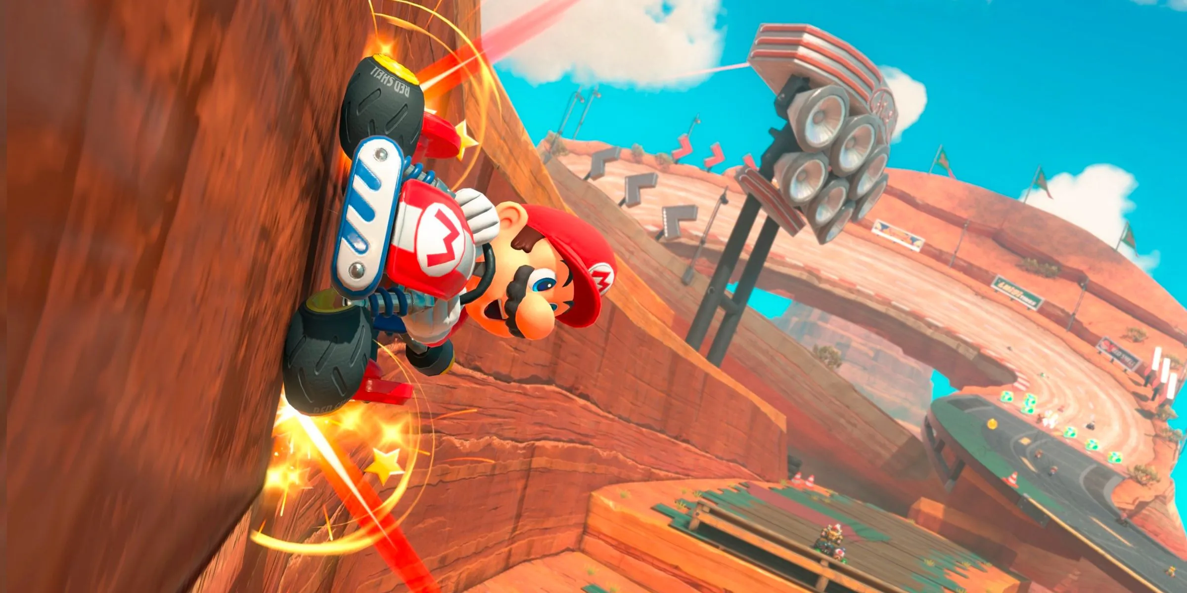 Mario đang lái xe trên tường trong Mario Bros. Circuit trong Mario Kart World.