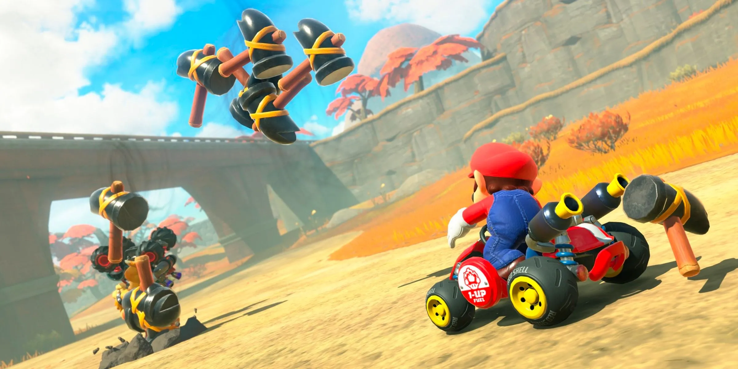 Mario sử dụng vật phẩm Hammer lên Bowser trong Mario Kart World.