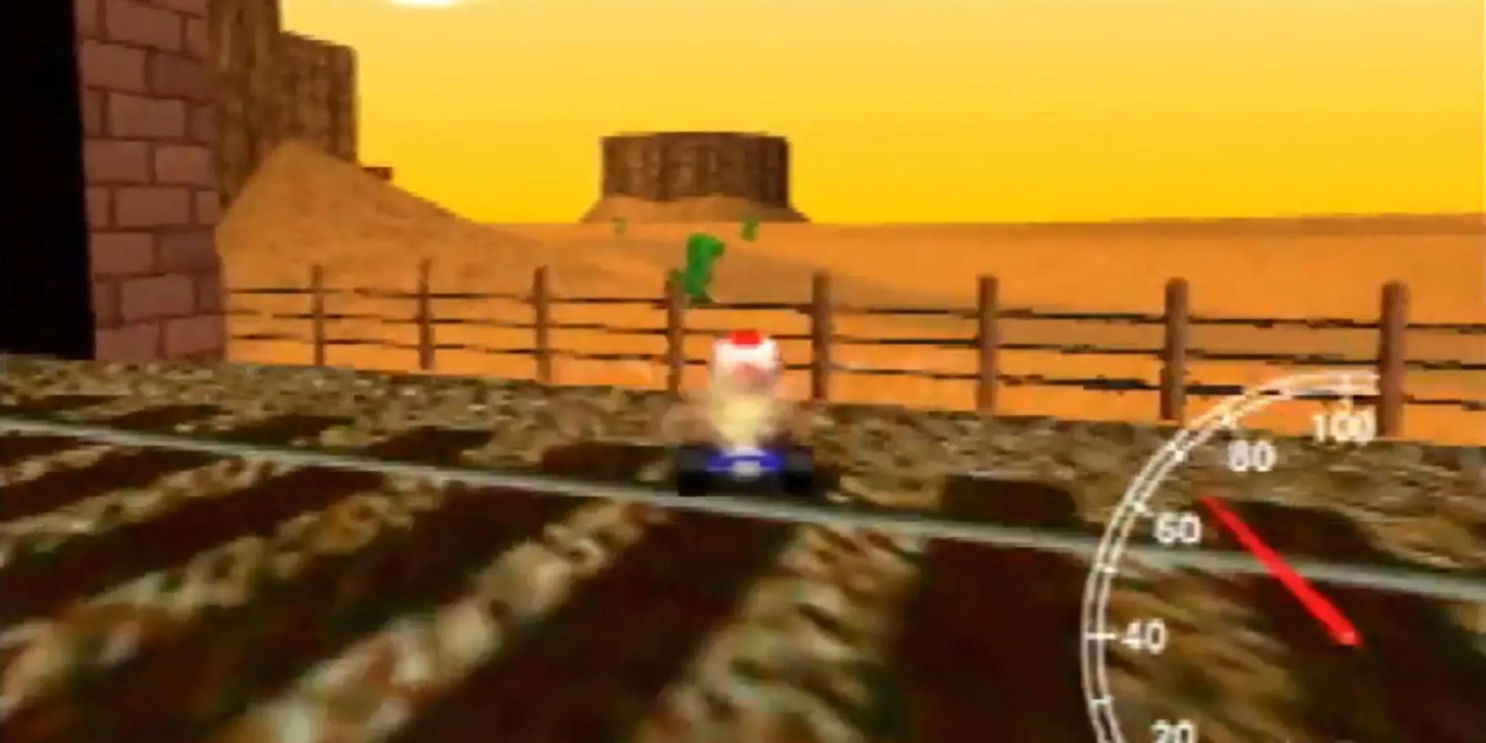 Toad chuẩn bị thực hiện glitch xuyên hàng rào trên đường đua Kalimari Desert trong Mario Kart 64.
