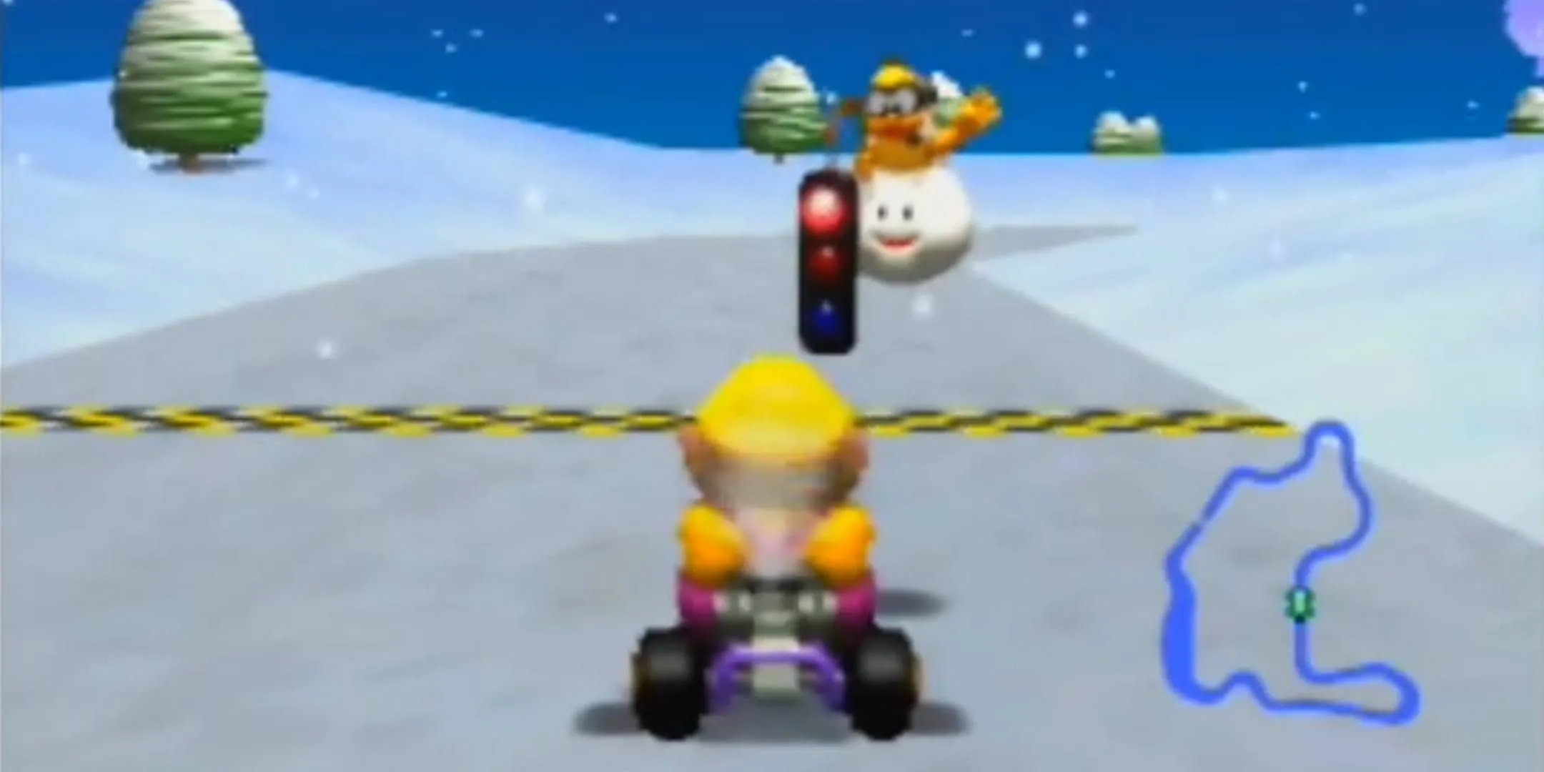 Wario chuẩn bị bắt đầu cuộc đua tại Frappe Snowland trong Mario Kart 64, đồ họa 3D ấn tượng trên N64.
